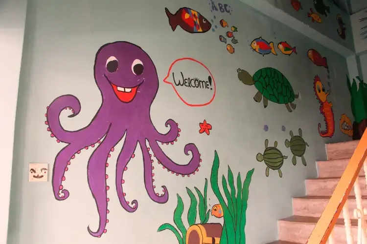 Artwork done by volunteers on the wall of Human Aid, an NGO that provides schooling to children from Myanmar. Image by Jueun Choi. Malaysia, 2017.<br />