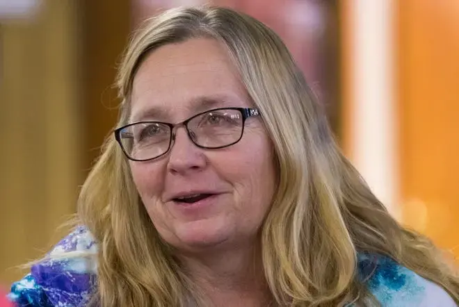 Brenda Statz, widow and the wife for 34 years to Leon Statz. Leon died by suicide after struggling to keep his farm solvent. Image by Mark Hoffman. United States, 2020.