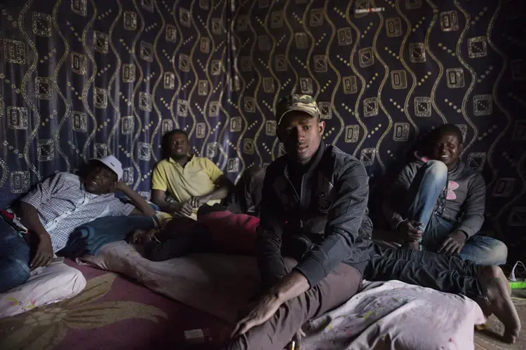 Young men at a fada (meeting house), in Agadez, Niger, Jan. 16, 2018. Image by Joe Penney. Niger, 2018.