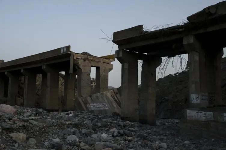 A bridge which connects Hajjah with the Bani Qais District is partially destroyed after an airstrike on May 6, 2018. Image by Alex Potter. Yemen, 2018.