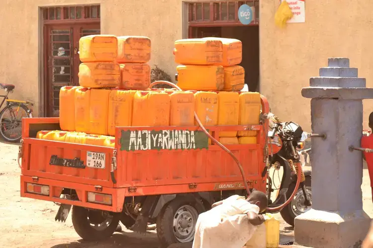 One of the methods used to transport “Maji ya Rwanda” to Goma, which has been very good business for Rwandans before COVID-19. Image by Fred Mwasa and Sylidio Sebuharara. Rwanda, undated.