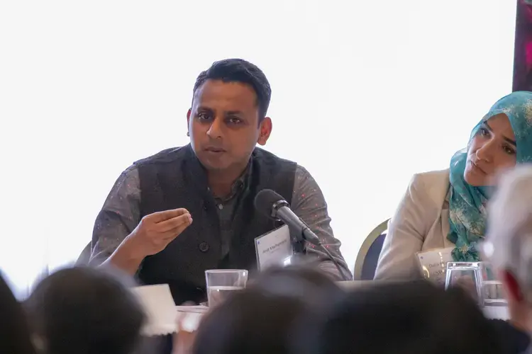 Filmmaker Amit Madheshiya explains the subject of his film, “The Hour of Lynching,” at the “Beyond Religion” conference. Image by Jin Ding. Washington, D.C., 2019.<br />