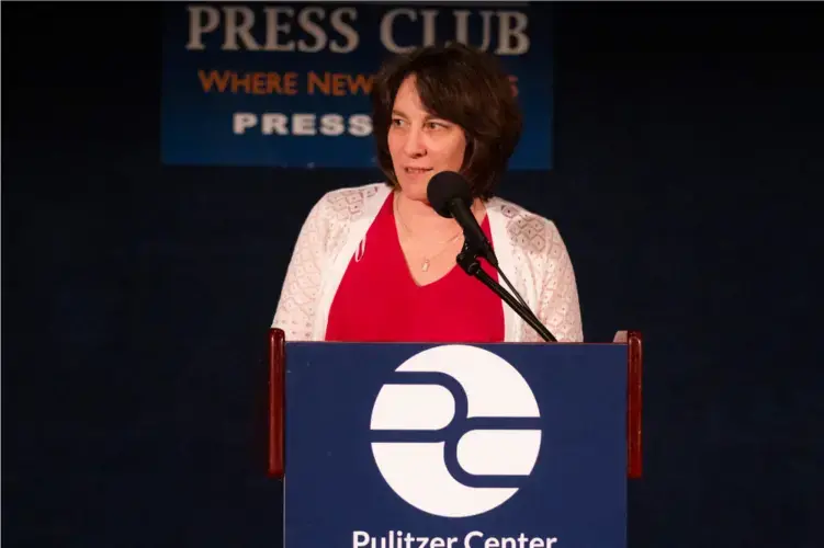 University and Community Outreach Director Ann Peters addresses the audience to highlight the Pulitzer Center's educational outreach efforts. In the past year, the Pulitzer Center's education programs reached more than 16,500 students. Image by Jin Ding. United States, 2019.