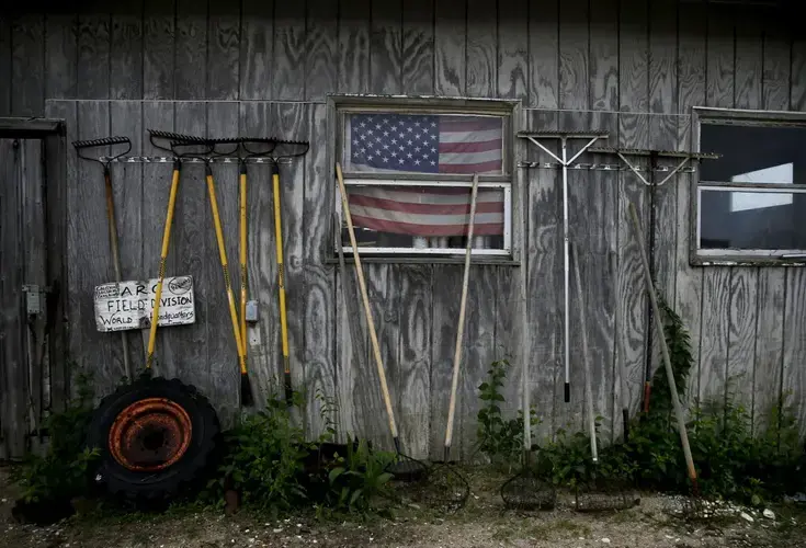 Rakes rested against an outbuilding at the A.R.C. Hatchery. Image by Jessica Rinaldi. United States, 2019.
