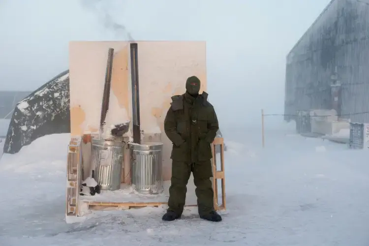 Crucial for survival, water can be difficult to obtain during winter military operations, and large amounts of fuel are necessary to continuously melt snow and ice. Image by Louie Palu. Canada, 2018.