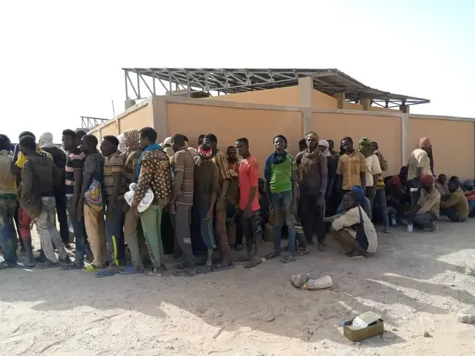 Some of nearly 100 Nigeriens arrive in Assamaka, Niger, on foot from Algeria and now must be quarantined for two weeks at the remote Sahara border settlement, where water is scarce and midday temperatures reach over 110 degrees (45 degrees Celsius). (IOM Niger via AP)