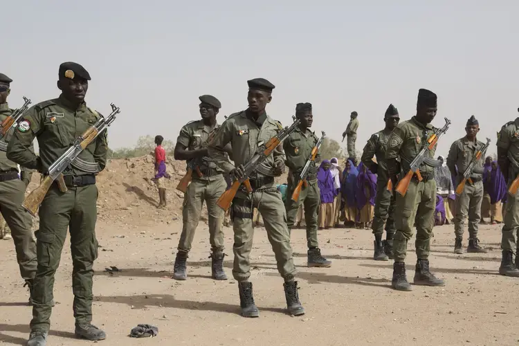 Police officers stand guard during an official ceremony in Agadez, Niger, Jan. 15, 2018. Image by Joe Penney. Niger, 2018.