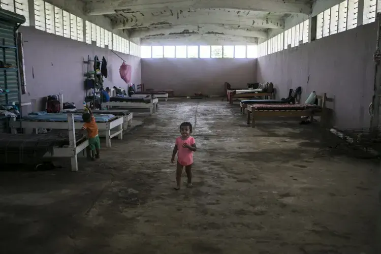 The Todo por Ellos ('all for them') shelter gives migrants a rag-tag refuge in a Mexican government building next to a Tapachula dump. Image by Jose Cabezas. Mexico, 2018.
