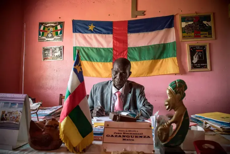 The destruction of many administrative buildings in the towns occupied by the Seleka—including the prefect’s residence in Bambari (left)—has hindered the rebuilding of shattered communities. But the biggest challenge in many places is coaxing frightened residents to return. The mayor of Bangui’s PK12 district, Jean Emmanuel Gazanguenza (right), has encouraged Muslims and Christians to return. So far no Muslims have done so. Image by Marcus Bleasdale. Central African Republic.