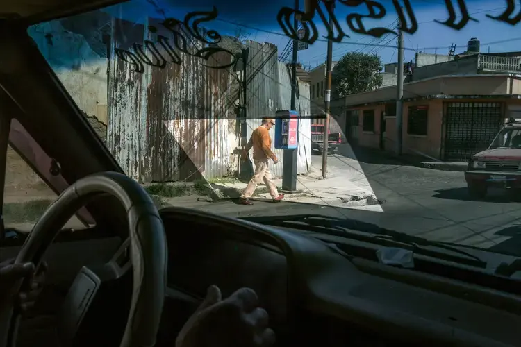 Julio López, Elias’s grandfather, drives outside the city of Quetzaltenango. Image by Mauricio Lima. Guatemala, 2019.<br />