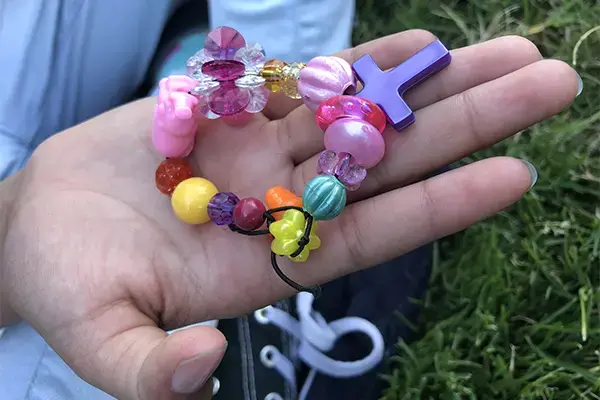 “Each bead means something,” Adrianna says of the bracelet she made me with her mom. “This one,” she says, pointing to the shiniest pink bead, “is supposed to be how much love she has for us because it is so bright.' Image by Jaime Joyce for TIME Edge. California, 2018.