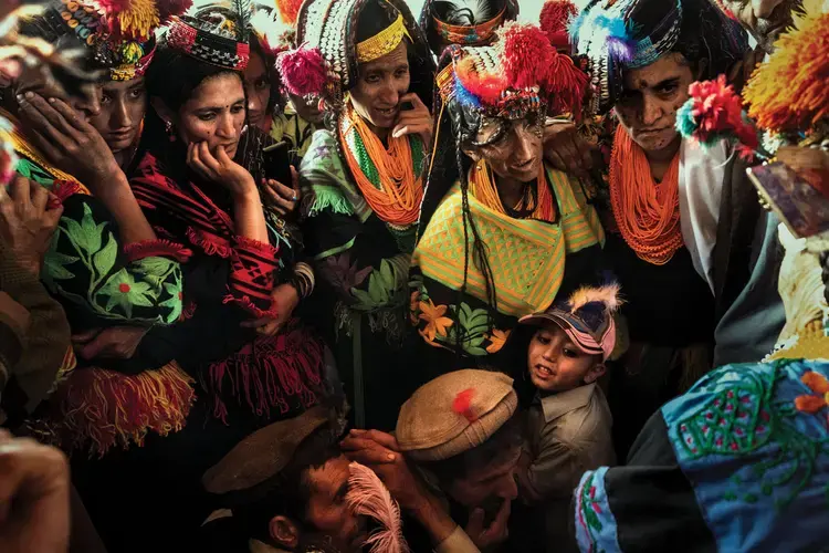 Kalasha participate in a ritual of ancestor remembrance. Image by Monika Bulaj. Afghanistan-Pakistan border, 2010.