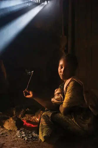 An Oromo woman with incense at a Sufi shrine. Image by Monika Bulaj. Ethiopia, 2014.