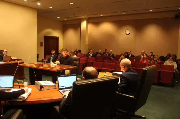 Zack Klein testifies in a public hearing for LB1003, a bill that would allow his hometown to start fresh on higher ground. Image by Christina Stella / Harvest Public Media. United States, 2020.