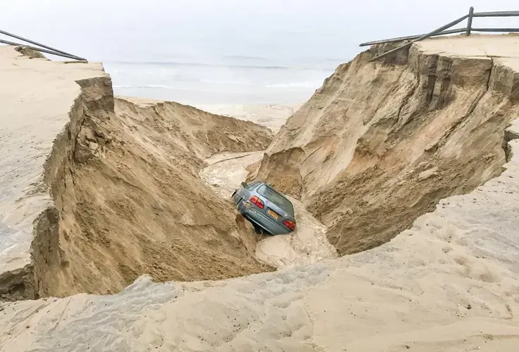 n Wellfleet, which received between 6 and 7 inches of rain in a storm in August 2017, the weather caused a car to fall into a sinkhole. Image by David Curran. United States, 2017.