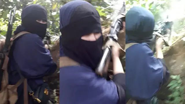 Cici Rezky Fantasy Rullie, said to be around 18, is believed to be the daughter of the Indonesian couple who bombed Jolo Cathedral in January 2019. Cici is seen here engaging in a shootout with the military. Image courtesy of Rappler-sourced video screengrab. Philippines, 2019.