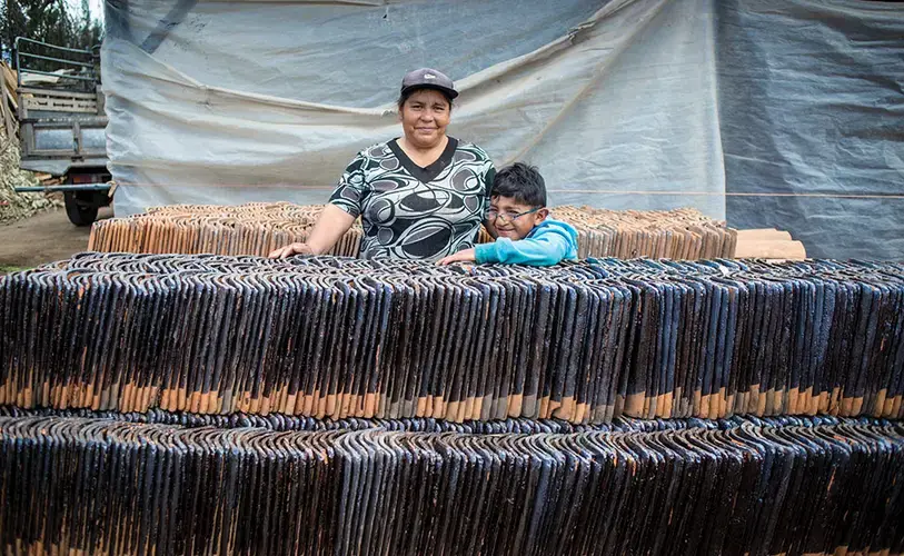 Érick Davíd Aguayo, 7, was born with a cleft lip. He's the grandson of Hilda María Suntasig, who has made clay tiles in La Victoria since she was 18 years old. Image by Yolanda Escobar. Ecuador, 2016. 