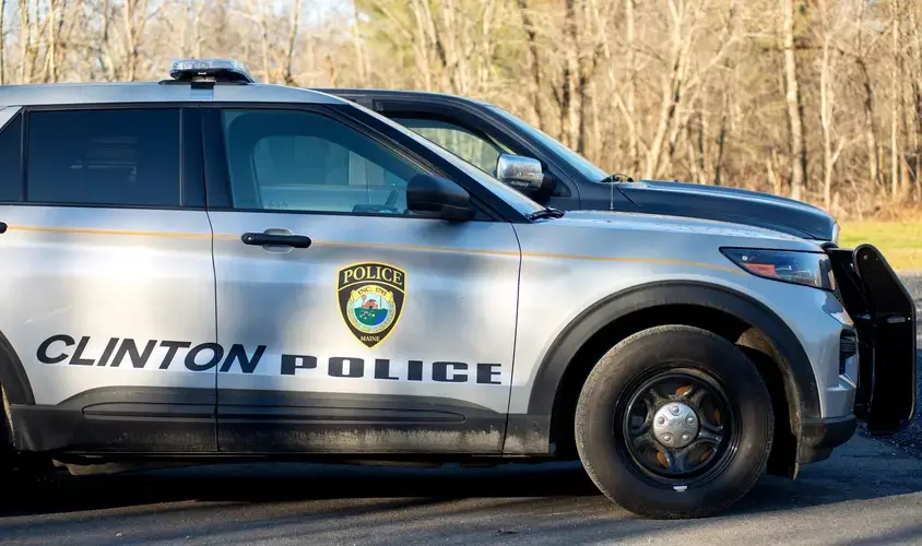 Police vehicles in the town of Clinton. Image by Linda Coan O'Kresik / BDN. United States, undated.