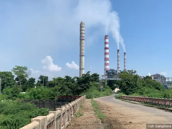 Around three-quarters of India's electricity is generated by coal plants such as this one operated by the National Thermal Power Corporation in Sonbhadra, Uttar Pradesh. The plant is on the eastern side of the Singrauli region in Madhya Pradesh, where THDC India Limited plans to build an opencast mine. Image by Tish Sanghera. India, 2019.