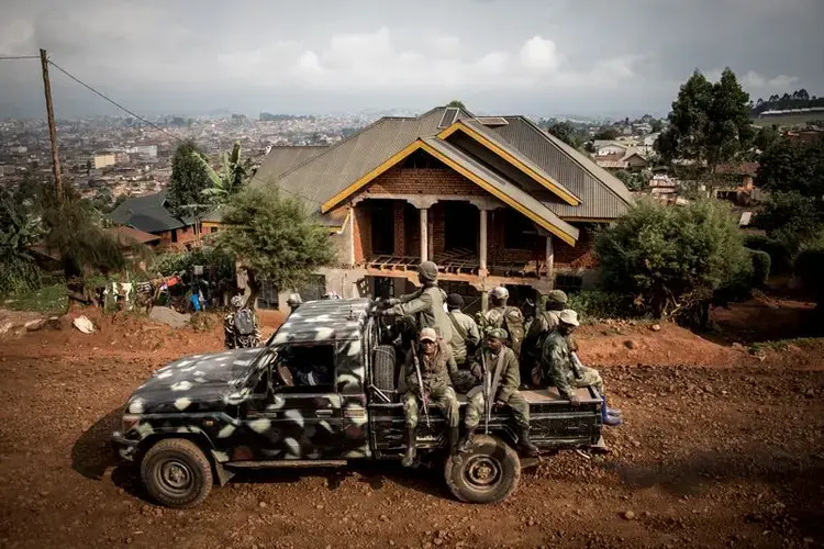 Soldiers patrol Butembo, a northeastern city in the DRC racked by conflict and Ebola. Image by John Wessels. Democratic Republic of Congo, 2019.<br />