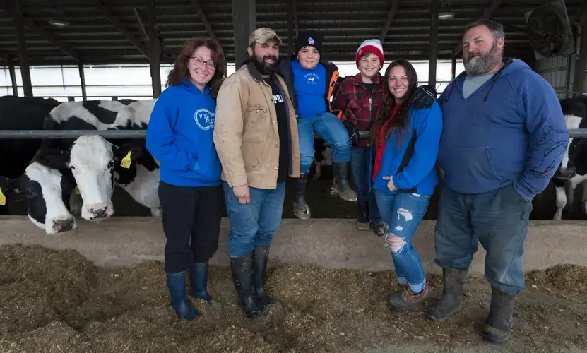 Theresa Hartwig, from left, son-in-law Tyler Gailloreto, grandsons Leo and Dominci Gailloreto, daughter Kim Gailloreto, and husband Jon Hartwig, at their farm in Fort Atkinson. Image by Mark Hoffman. United States, 2019.