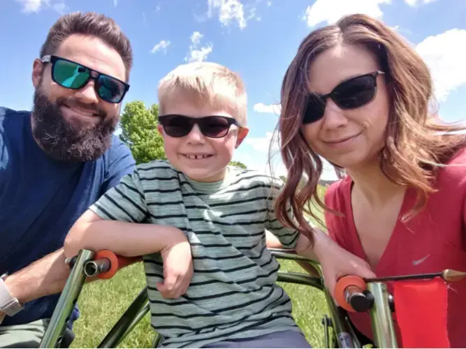 Kathryn and Tyler Atchley have been trying to spend as much time as possible outside with their 7-year-old son, Parker, since the pandemic began. Parker, who has a rare neurological condition, enjoys taking long walks with his parents. Image courtesy of the Atchley family.