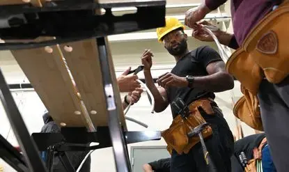 Devin Carr enrolled in Project Jumpstart to learn a trade after he finished serving a seven-year prison sentence. The 33-year-old Carr says his child support debt ballooned to $25,000 while he was behind bars. Like his debt, much of the unpaid child support nationally is estimated to be owed by parents who are or have been in prison. Image by Lloyd Fox / Baltimore Sun. United States, undated.