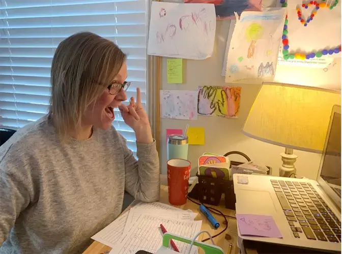 Julie Pierce gestures to her second grade students during a Zoom call. Pierce has spent the entire school year teaching remotely, but Hickman Mills has tentative plans to bring students back in March. Image courtesy of Julie Pierce. United States, undated.