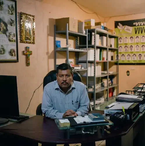Raymundo Ramos Vázquez, the director of the Human Rights Committee of Nuevo Laredo, inside of his office. Image by by Christopher Lee. Mexico, 2020.
