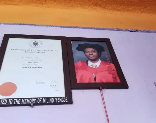 Suraj's graduation photo at home. Image by Phillip Martin. United States, 2019.