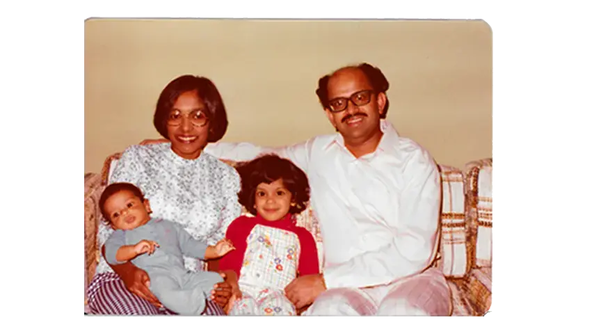 Indira and Bala Pillay at home with their son, Ramesh, and daughter, Kavita. Image courtesy of Kavita Pillay/WBGH News.