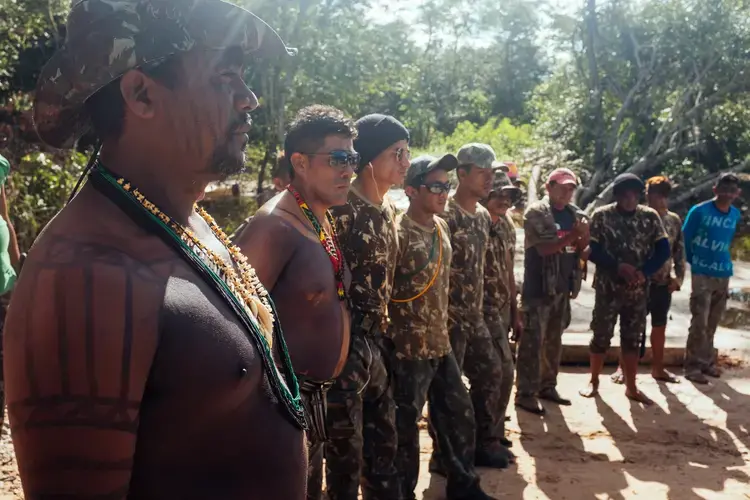 Guardians assemble before heading out to investigate a report of an illegal marijuana farm. Their job is dangerous: more than 140 people have been killed in Brazil defending land since 2015. Image by Sam Eaton. Brazil, 2018.