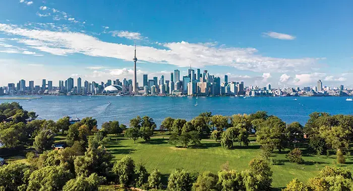 Beneficiary of the rich economic opportunities the Great Lakes have to offer, Toronto is thriving — but also facing new challenges in the face of climate change. Image by iStockphoto.com/R.M. Nunes. Canada, undated.