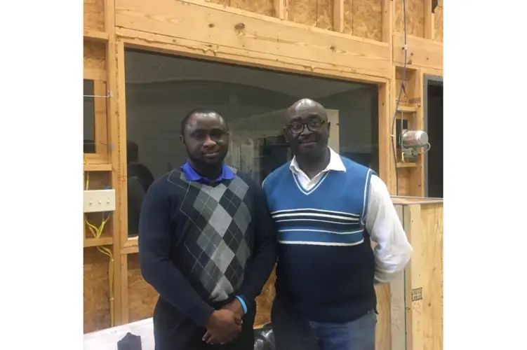 Engineers Akinbode Adedeji (left) and Francis Agbali at the University of Kentucky. Image by Roxanne Scott. Kentucky, 2018.