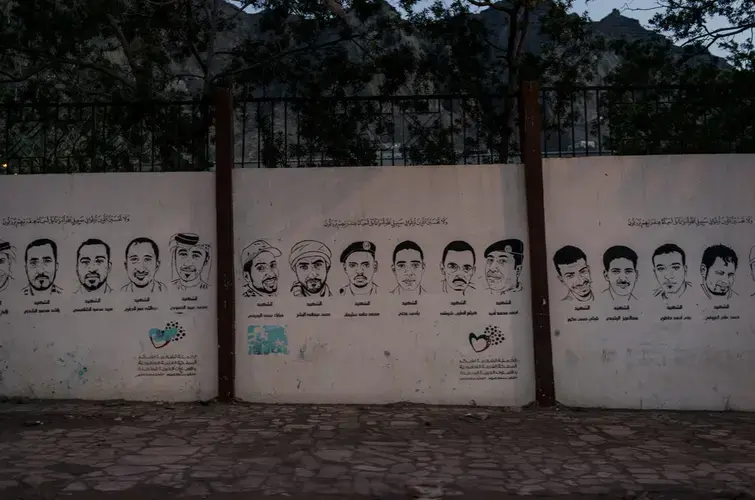 Images of Yemenis killed in the 2015 battle against the Houthis are painted on the walls of main streets in Aden, Yemen. Image by Alex Potter. Yemen, 2018. 