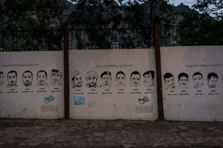 Images of Yemenis killed in the 2015 battle against the Houthis are painted on the walls of main streets in Aden, Yemen. Image by Alex Potter. Yemen, 2018.