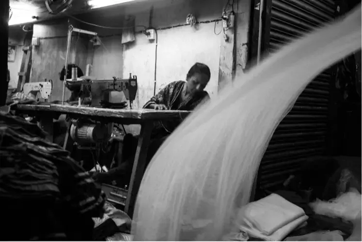 A garment worker in Dhaka, Bangladesh. Image by Jošt Franko. Bangladesh, 2016.