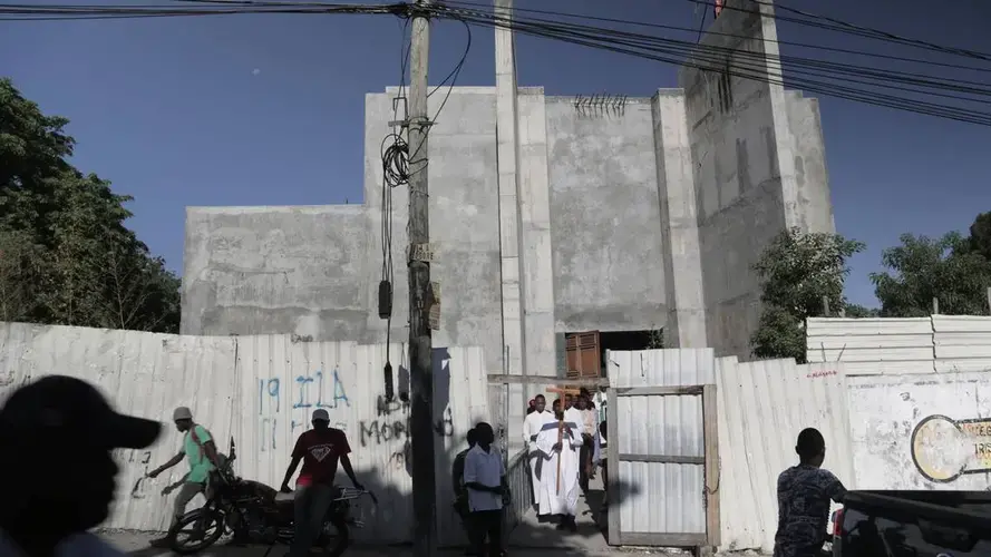Altar boys file out of an unfinished St. Louis Roi de France Catholic Church on Nov. 17 in Port-au-Prince’s Turgeau neighborhood. Image by Jose A. Iglesias. Haiti, 2020.