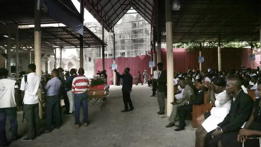 People pray inside Sacred Heart Catholic Church in Port-au-Prince during a funeral for five people killed during anti-government protests in Haiti. Image by Jose A. Iglesias. Haiti, 2020.
