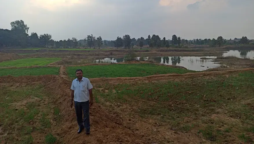 Hariram, an Adivasi farmer from Katangi stands at his farm, also in the orange areas. He was recently appointed as president of the village forest rights committee under the Forest Rights Act. Image by Nihar Gokhale. India, undated. 