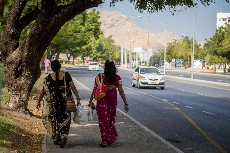 Two Indian domestic workers return from a local church after a Sunday mass. Image by Svanika Balasubramanian. Oman, 2019.