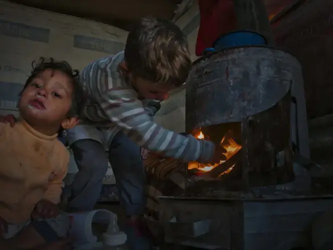 Many households burn scrap wood, coal, and even textiles and trash in order to keep warm. Indoor air pollution can be even more dangerous. Image by Larry C. Price. Macedonia, 2018.