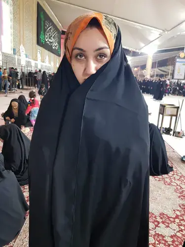 Zahra Ahmad stands in the courtyard of the Imam Ali ibn Abu Talib's mosque in Najaf, Iraq. Image courtesy of Ahmad family. Iraq, 2019.