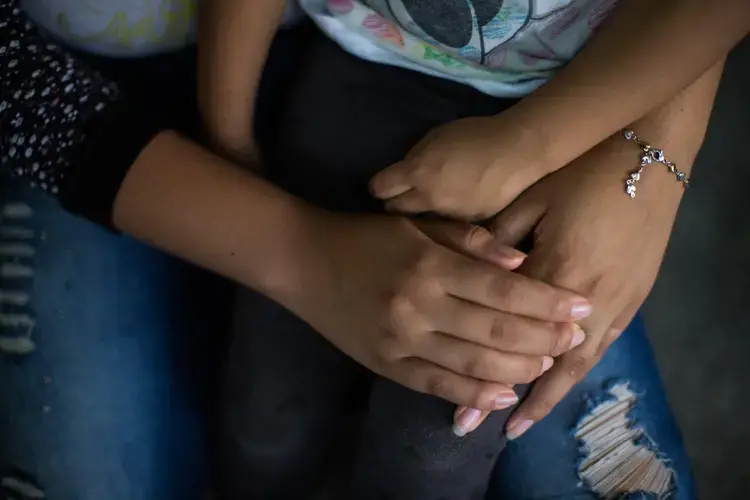 Sarai accompanies Ashley in the afternoons twice a week after school. When they’re not together, they miss each other. Image by Almudena Toral. El Salvador, 2018.