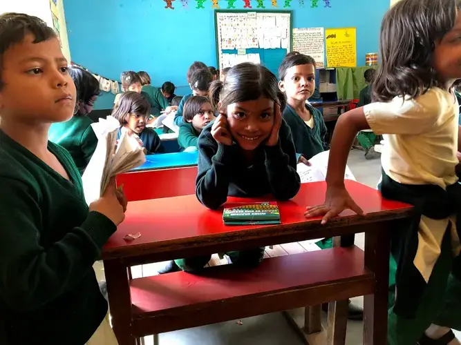 A student smiles during a school day at Pardada Pardadi. Image by Annalisa Merelli. India, 2018. 