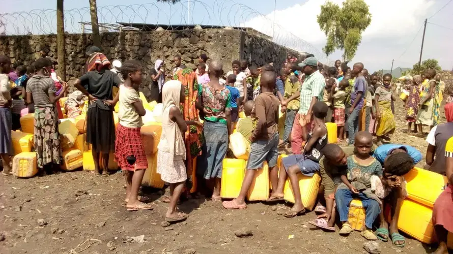 Waiting for water at a neighborhood tap in a Goma neighborhood. Image by Fred Mwasa and Sylidio Sebuharara. Democratic Republic of the Congo, undated.