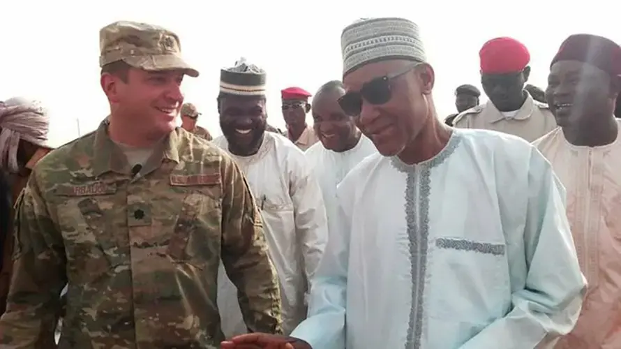 Air Force Lt. Col. Brad Harbaugh and the governor of the Agadez region, Sadou Soloké, during a group visit to the base in Agadez, Niger on Feb. 21, 2018. Image by Ibrahim Manzo Diallo. Niger, 2018.