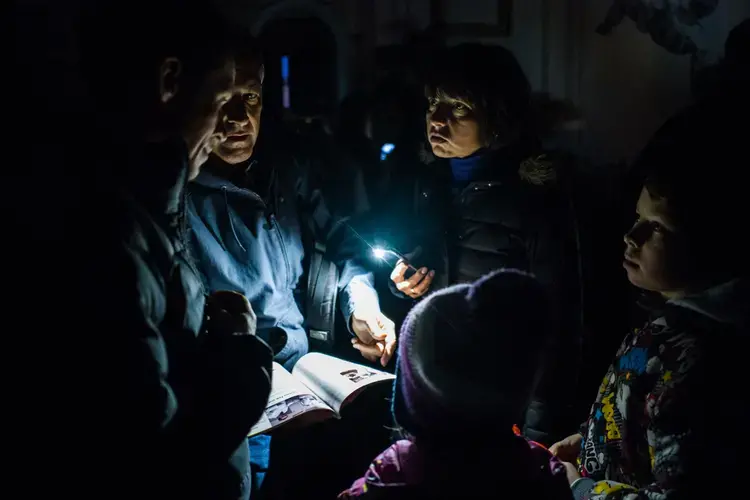 Repeated power failures gave Cohen more time to interview Tatiana Vinogradova, deputy director of the St. Petersburg AIDS center, and her husband Andrei Skvortsov, who is living with HIV. Image by Misha Freidman. Russia, 2017.
