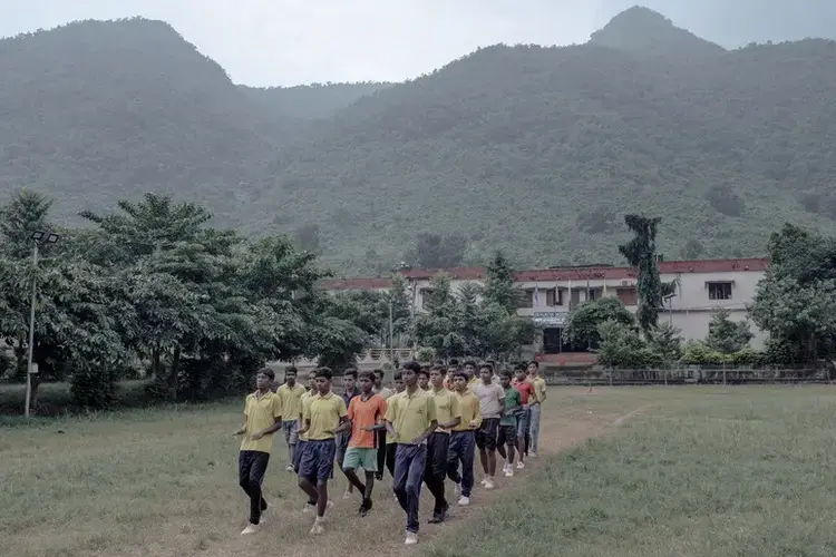 Marching practice on the school playground after the end of classes. Image by Arko Datto. India, 2018.