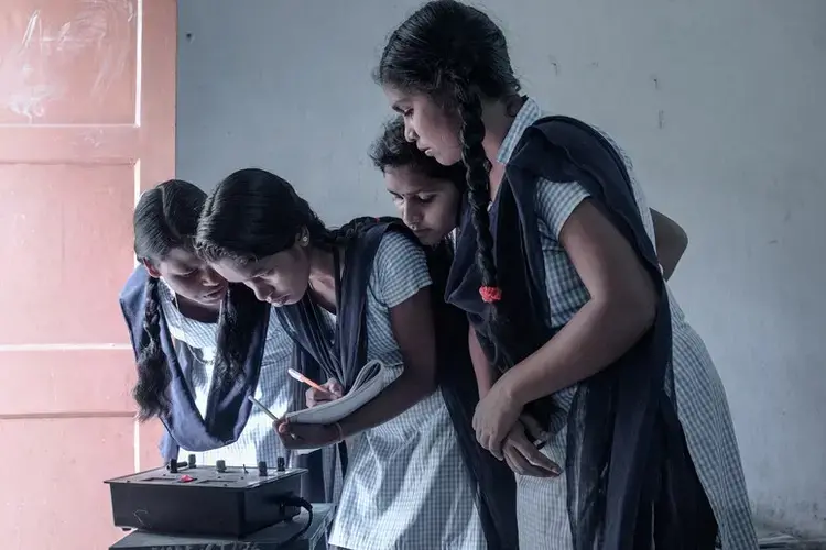 Purnima and her classmates in the physics lab. Image by Arko Datto. India, 2018.